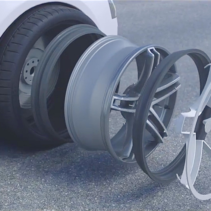 Now potholes are not a problem for these flexible wheels. Because this wheel bends with an ordinary tire. It's known as the MAXION Flexible Wheels. It's created by the tire maker, Michelin. It uses a technology called 'Acorus'. Which means a pair of flexible rubber flanges attached to a special alloy wheel. So it absorbs the shock when the wheel encounters a pothole.  The flange flexes with the rubber to avoid damage to the tire, and absorbs the impact from the pothole. In certain countries with bad road conditions half of the tires don't reach the end of their life due to the sidewall damage. The flexible wheel combines an aluminum wheel body, two rubber flanges, and optional wheel cover inserts for aesthetic purposes. When the tire facing a road hazard the flange is deformed to protect the tire and the wheel body, so both of them stay intact. And therefore the driver and the passengers are kept safe. These flexible wheels together with the Michelin Acorus technology will essential avoid sidewall damage due to potholes. And therefore it optimizes tire lifetime. The flexible wheels allows you to easily control the vehicle after hitting a pothole. The flexible wheel is not just a robust safety solution. It's a beautiful wheel and providing a unique level of driving experience for premium vehicles. Check the wheel here! Watch the Flexible Wheels in action down below: