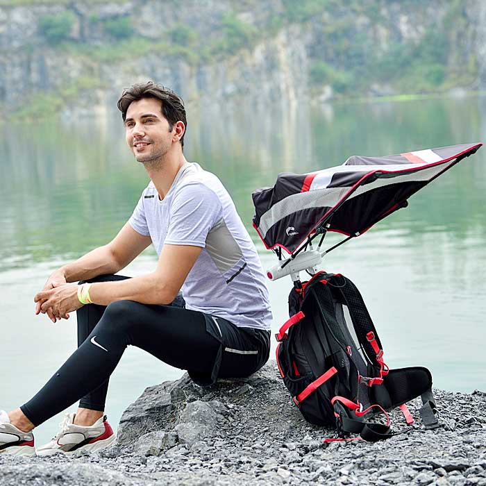 This Backpack Has a Retractable Umbrella For Sun and Rain Protection While Hiking