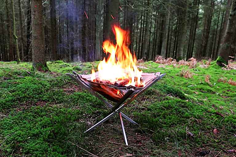 fire pit takes wood fire and grilling anywhere