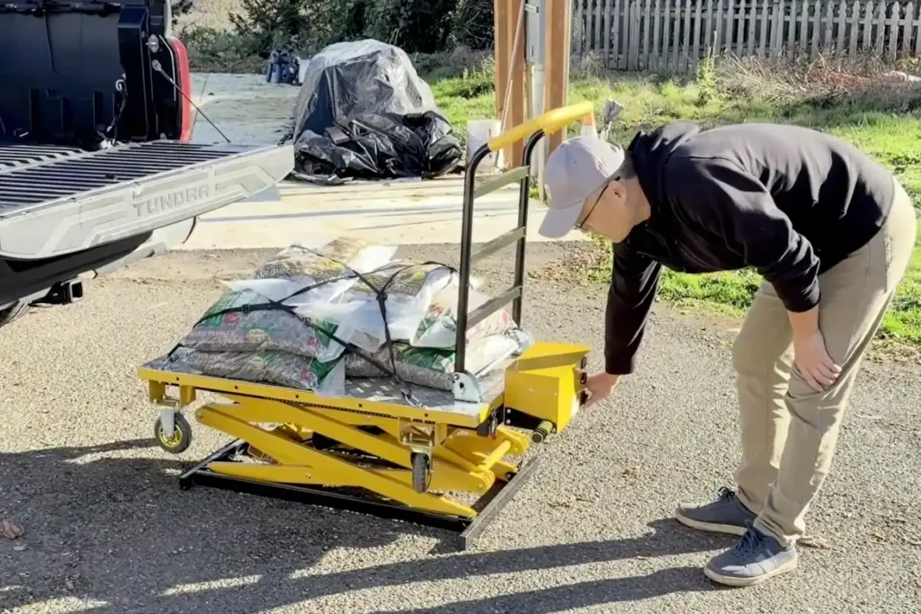 A lift and slide cart for loading trucks without manual lifting.