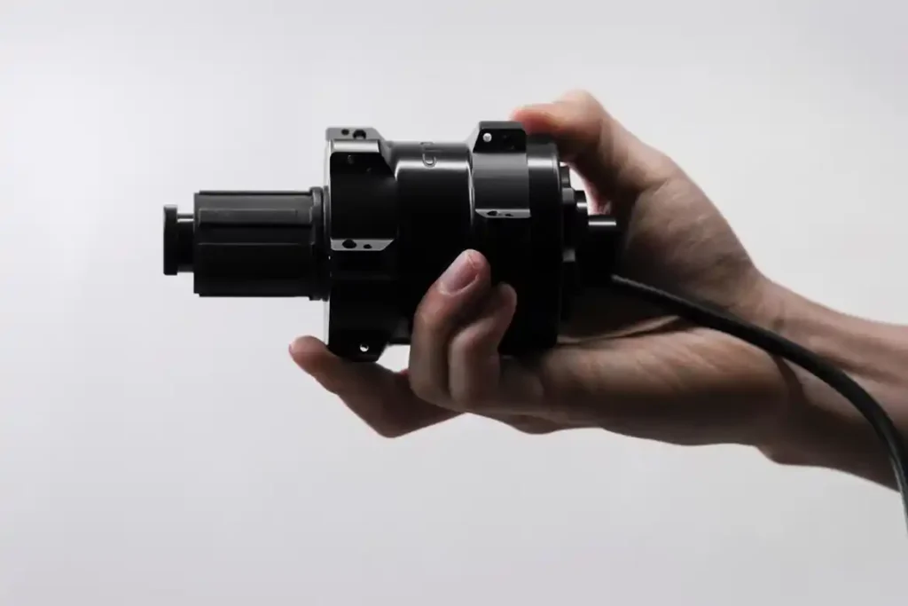 Compact hub motor installed on a thru-axle wheel.