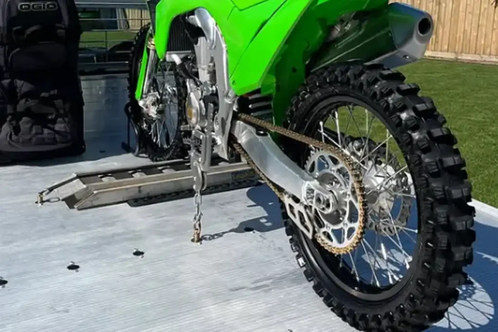 Stop crushing your forks with straps. Lock your bike from the footpegs instead.