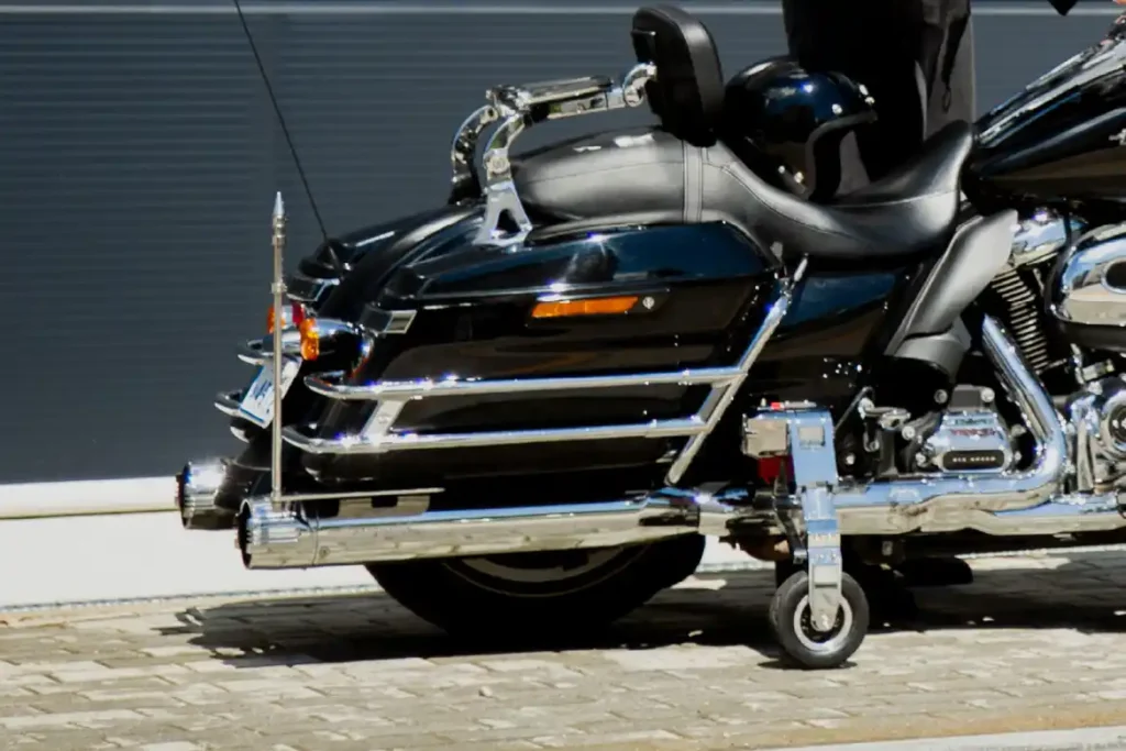 Support wheels deployed while the motorcycle is stopped.